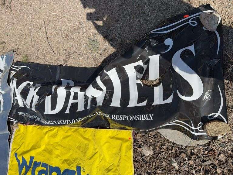 Jack Daniel’s banner has rips image