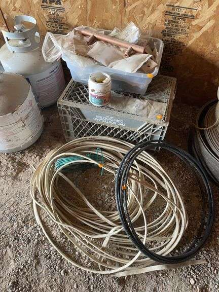 Miscellaneous rules of electrical wire, milk crate, and plastic tote with hardware image