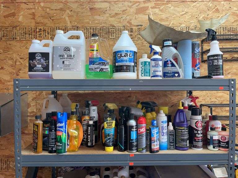 Contents of top two shelves. Lots of car cleaning chemicals, etc. image