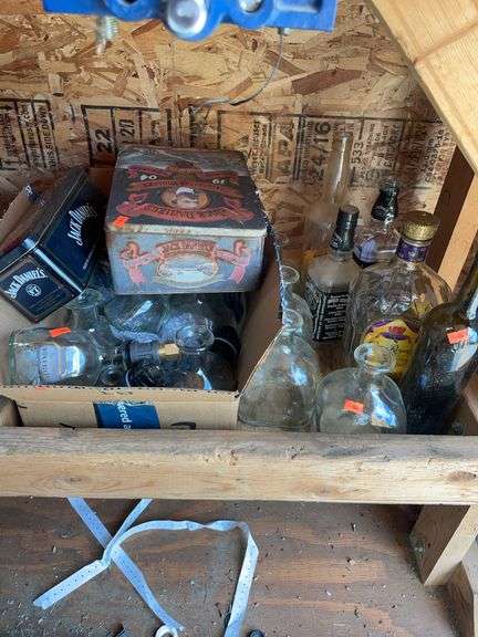 Lot of miscellaneous liquor bottles, and Jack Daniels tins image