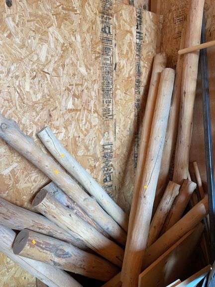 Several wooden log poles image
