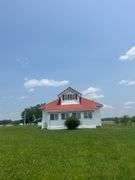 11324 Rineyville Road • Vine Grove, KY TWO HOMES • FINISHED METAL BUILDING (BARNDOMINIUM) • 70'x40' BARN • 9± ACRES