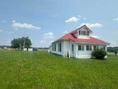 11324 Rineyville Road • Vine Grove, KY TWO HOMES • FINISHED METAL BUILDING (BARNDOMINIUM) • 70'x40' BARN • 9± ACRES