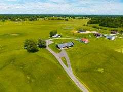 11324 Rineyville Road • Vine Grove, KY TWO HOMES • FINISHED METAL BUILDING (BARNDOMINIUM) • 70'x40' BARN • 9± ACRES