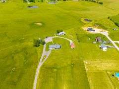 11324 Rineyville Road • Vine Grove, KY TWO HOMES • FINISHED METAL BUILDING (BARNDOMINIUM) • 70'x40' BARN • 9± ACRES