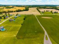 11324 Rineyville Road • Vine Grove, KY TWO HOMES • FINISHED METAL BUILDING (BARNDOMINIUM) • 70'x40' BARN • 9± ACRES