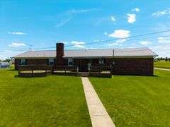 11324 Rineyville Road • Vine Grove, KY TWO HOMES • FINISHED METAL BUILDING (BARNDOMINIUM) • 70'x40' BARN • 9± ACRES
