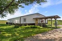 11324 Rineyville Road • Vine Grove, KY TWO HOMES • FINISHED METAL BUILDING (BARNDOMINIUM) • 70'x40' BARN • 9± ACRES