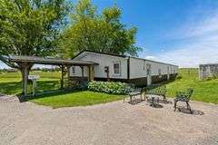 11324 Rineyville Road • Vine Grove, KY TWO HOMES • FINISHED METAL BUILDING (BARNDOMINIUM) • 70'x40' BARN • 9± ACRES