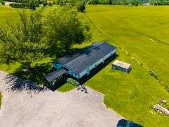 11324 Rineyville Road • Vine Grove, KY TWO HOMES • FINISHED METAL BUILDING (BARNDOMINIUM) • 70'x40' BARN • 9± ACRES