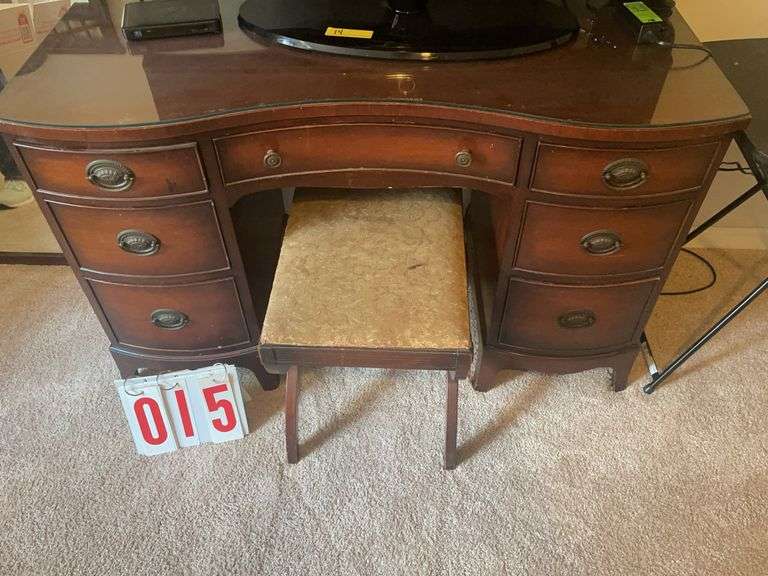 Vanity with glass top with bench and mirror image
