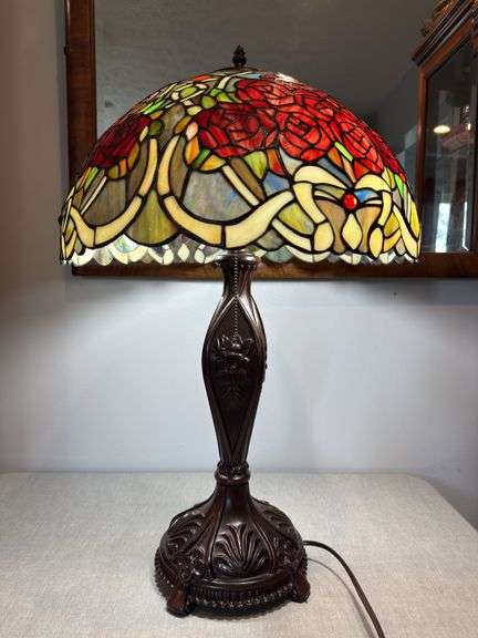 Stained glass style red rose lamp with decorative base. Lamp approximately 26" tall, shade approximately 18" wide