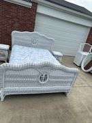Rattan full size bed with mattress and box spring. 2 night stands