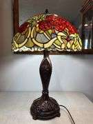 Stained glass style red rose lamp with decorative base. Lamp approximately 26" tall, shade approximately 18" wide