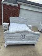 Rattan full size bed with mattress and box spring. 2 night stands