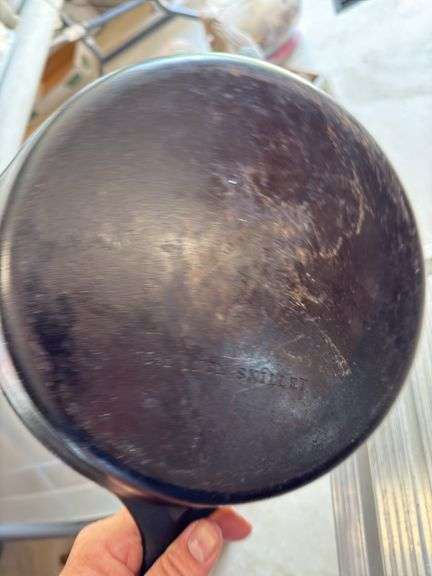Group of cast iron skillets as shown