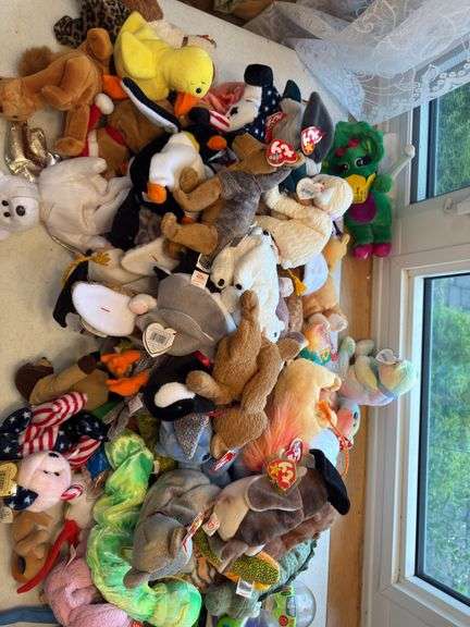 Beanie babies and Toy Story dolls as shown