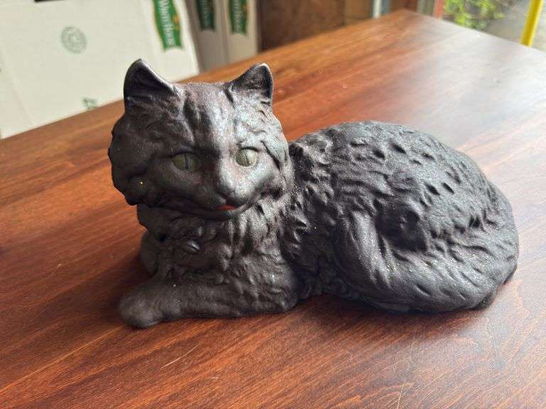 2 cast iron cats