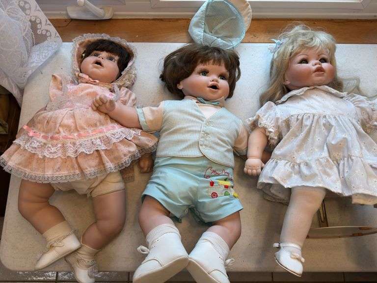 Large lot of dolls and stuffed animals
