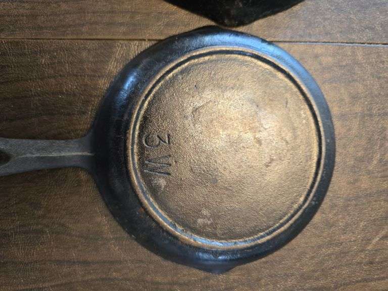 2 small cast iron pans