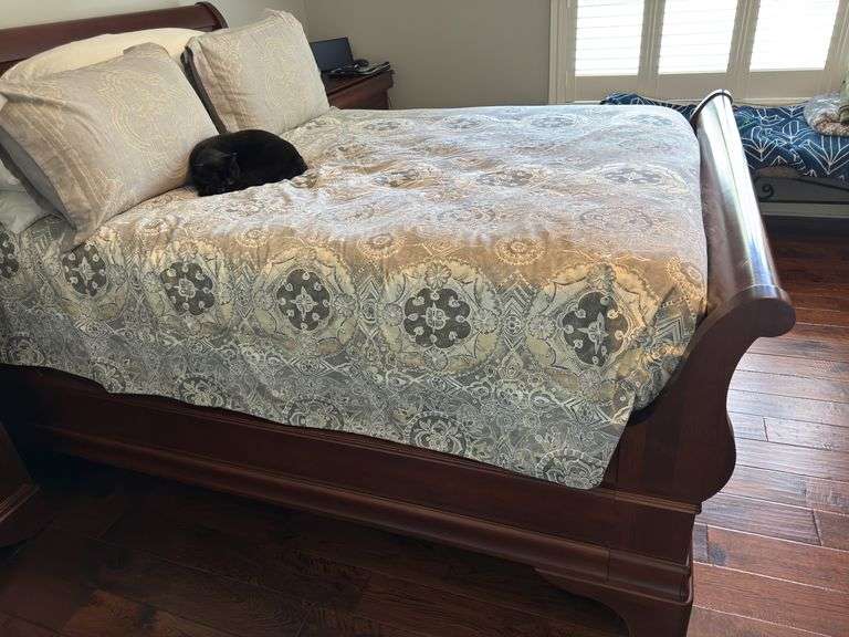 Queen size sleigh bed - frame only. No mattress, box spring or linens.