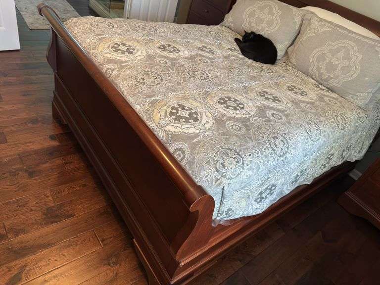 Queen size sleigh bed - frame only. No mattress, box spring or linens.