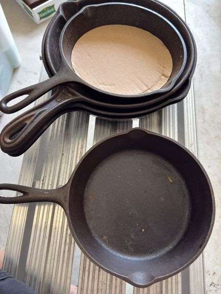 Group of cast iron skillets as shown