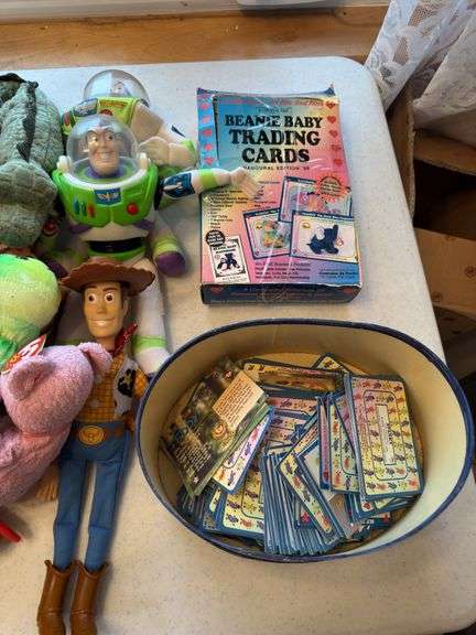 Beanie babies and Toy Story dolls as shown