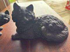 2 cast iron cats