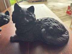 2 cast iron cats
