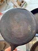 Group of cast iron skillets as shown