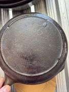 Group of cast iron skillets as shown