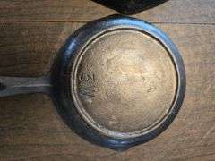 2 small cast iron pans