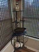 Plant stand with contents. 64” tall. Fits in corner