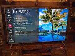 LG 75” TV UK6190PUB 4k HDR Smart UHD TV. Approximately 66” wide by 41” tall.