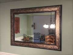 Wall mirror 44” wide by 32” tall