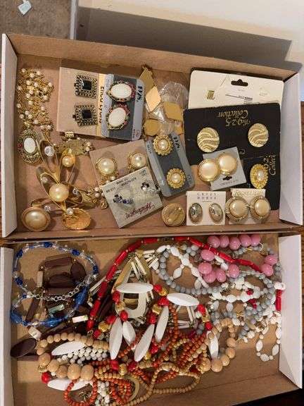 2 boxes of Costume jewelry as shown. All items reacted to earth magnet