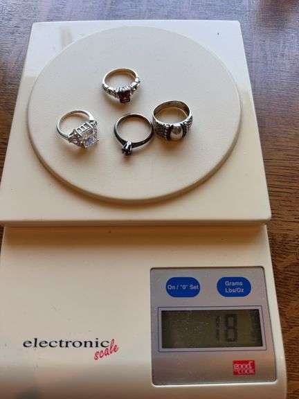 .925 silver rings. Not a diamond! Approximately .56 pennyweights