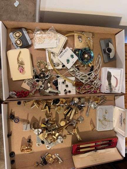 2 boxes of Costume jewelry as shown. All items reacted to earth magnet