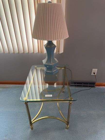 Glass top table with lamp. Table is 22” wide by 21” tall by 27” across