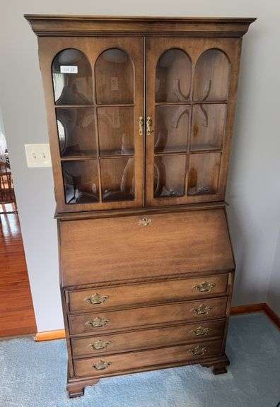 Walnut secretary desk with display cabinet above. 34” wide by 70” tall by 16” deep