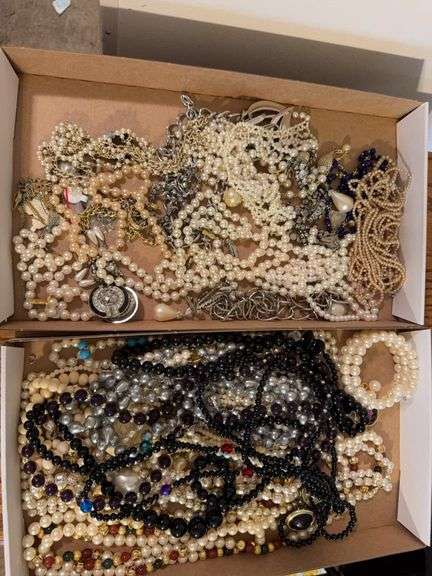 2 boxes of Costume jewelry as shown. All items reacted to earth magnet