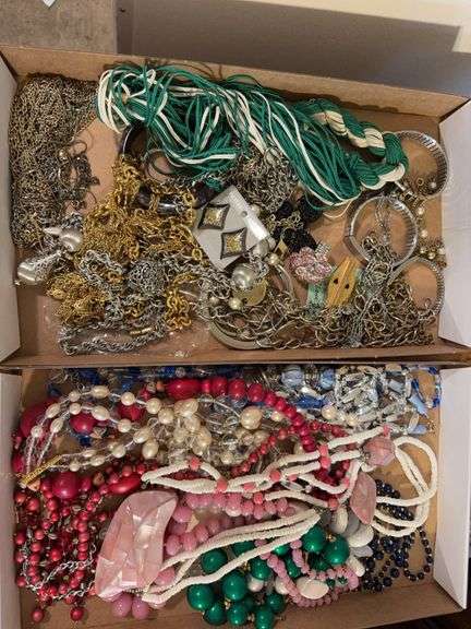 2 boxes of Costume jewelry as shown. All items reacted to earth magnet