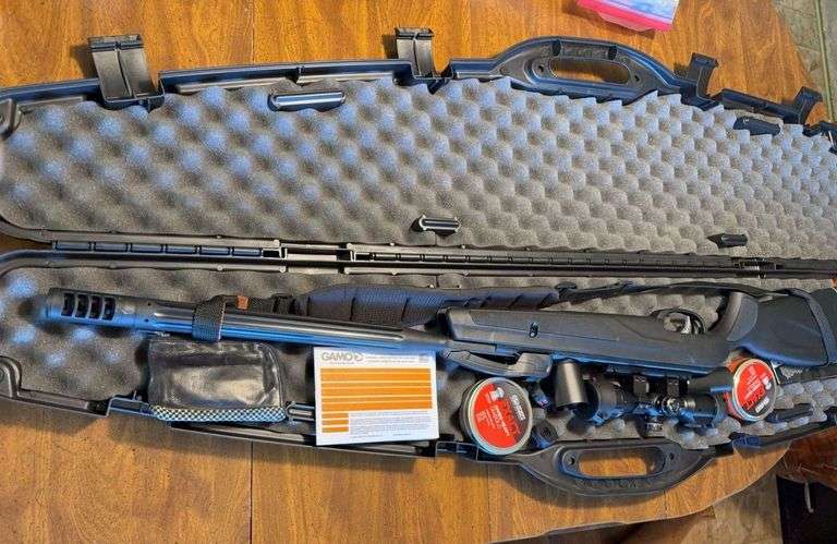 Gamo .22 caliber pellet rifle with case and accessories