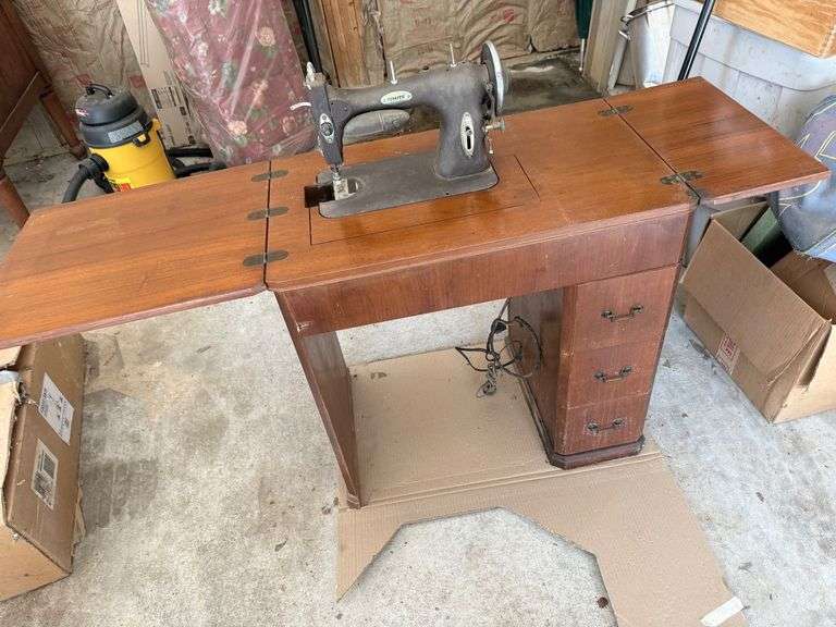 Sewing Machine in Cabinet with White Rotary Sewing Machine image