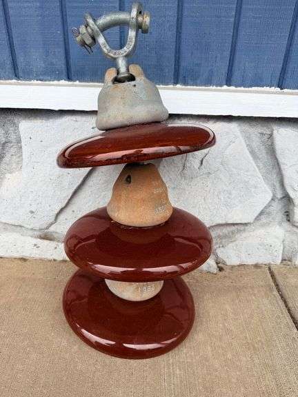 Tower of Power: Multi-Tiered Brown Ceramic Electrical Insulator image