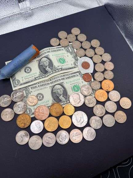 Coin Collection Featuring Nickels, Dollars, and More image