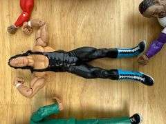Collection of Wrestling Action Figures with Money in the Bank Briefcase