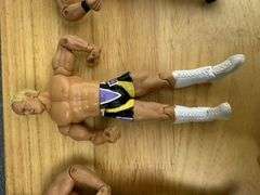 Collection of Wrestling Action Figures with Money in the Bank Briefcase