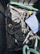 Outdoor Storage Box with Assorted Garden Hoses and Accessories